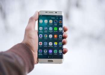mobile phone with apps on display.