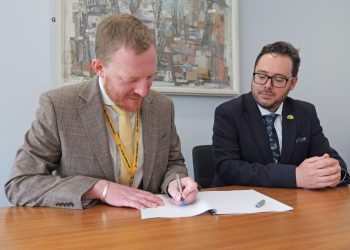 Newcastle Lib Dem and Green group leaders Colin Ferguson and Nick Hartley signing a 'Stability and Co-operation Agreement' to decide the future of the city