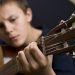 boy playing guitar